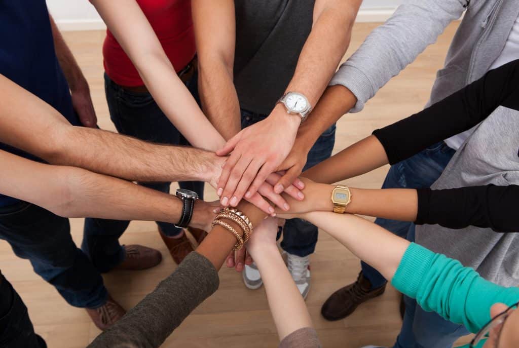 Multiethnic College Students Stacking Hands